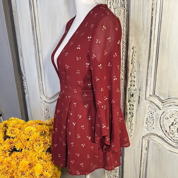 Ruby Red Ruffled Sheer Romper with Plunge Neckline and Statement Sleeves - Picture 7 of 11